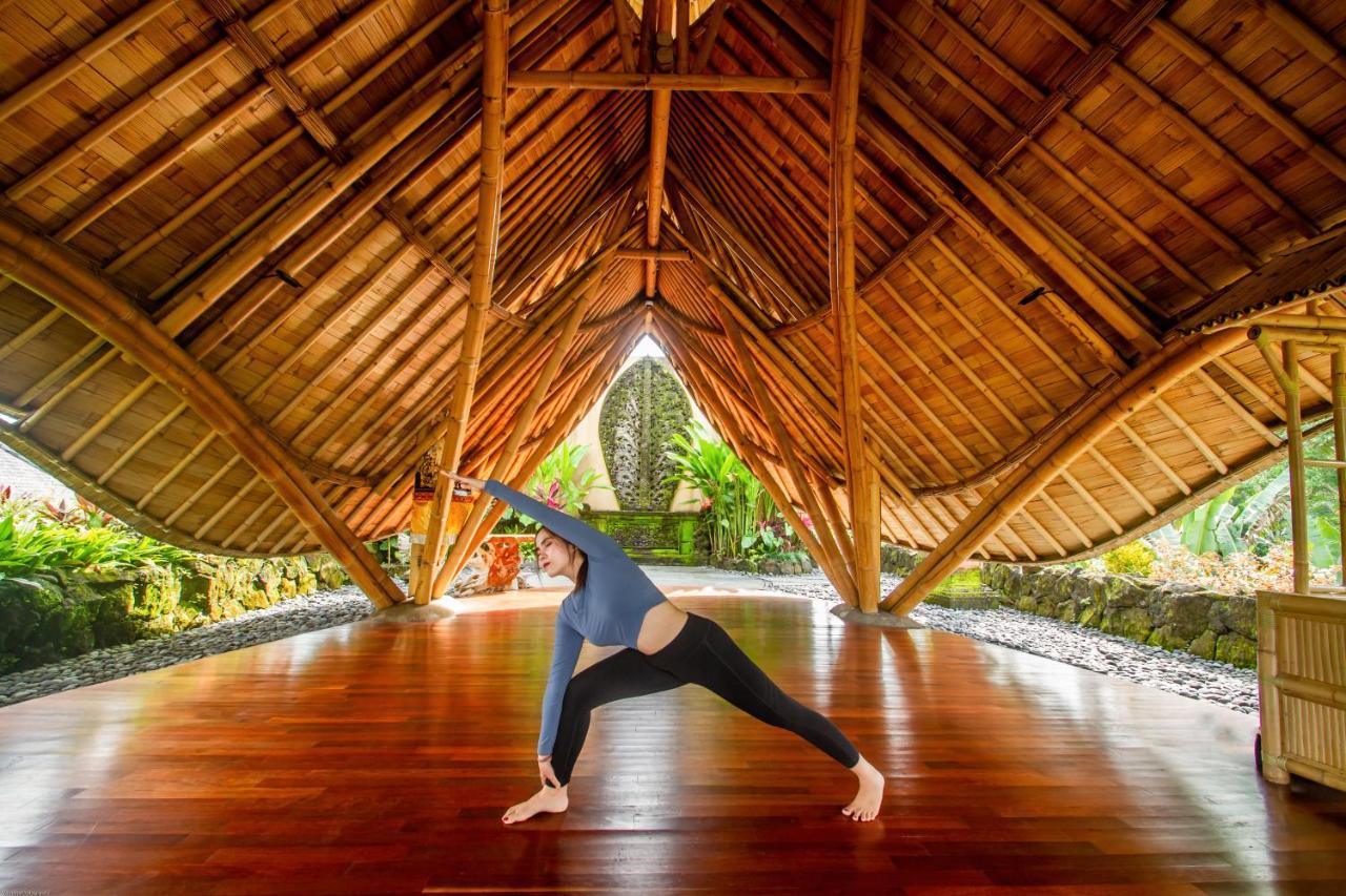 Weda Cita Resort And Spa By Mahaputra Ubud Eksteriør bilde A woman practicing yoga at the Four Seasons Resort Maui